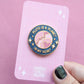 Pluto is a Planet in my Heart enamel pin sparkly on backing card