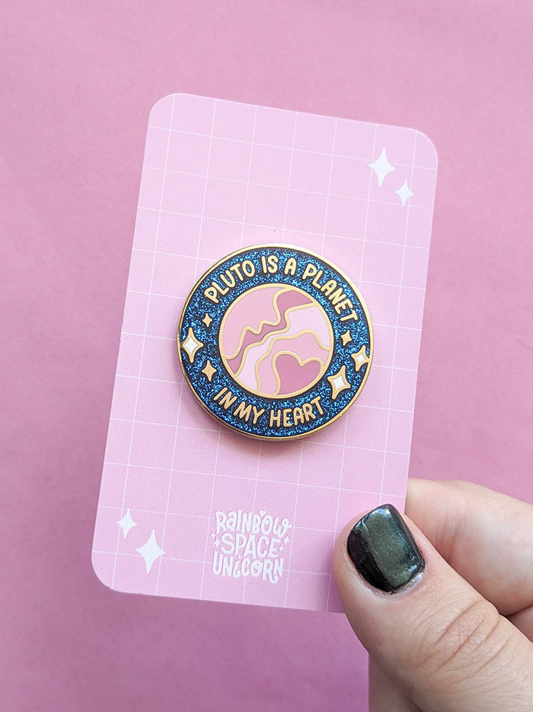 Pluto is a Planet in my Heart enamel pin sparkly on backing card